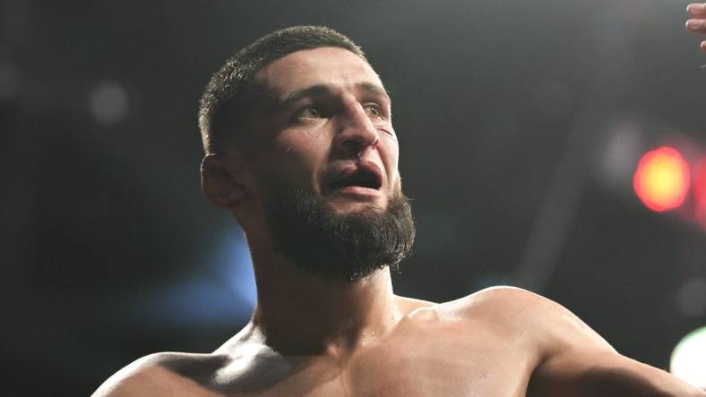 Apr 9, 2022; Jacksonville, Florida, USA;  Khamzat Chimaev (blue gloves) after a fight against Gilbert Burns (red gloves) during UFC 273 at VyStar Veterans Memorial Arena. Mandatory Credit: David Yeazell-USA TODAY Sports