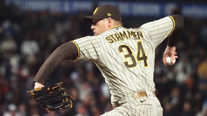 Apr 11, 2022; San Francisco, California, USA; San Diego Padres relief pitcher Craig Stammen (34) pitches the ball against the San Francisco Giants during the seventh inning at Oracle Park. Mandatory Credit: Kelley L Cox-USA TODAY Sports