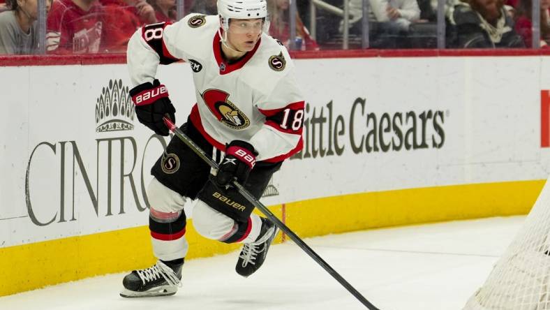 Apr 12, 2022; Detroit, Michigan, USA; Ottawa Senators left wing Tim Stutzle (18) skates with the puck during the second period against the Detroit Red Wings at Little Caesars Arena. Mandatory Credit: Raj Mehta-USA TODAY Sports