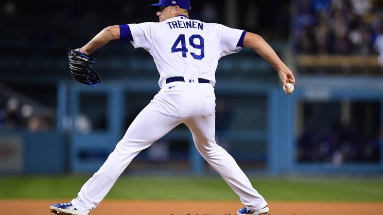 Apr 14, 2022; Los Angeles, California, USA; Los Angeles Dodgers relief pitcher Blake Treinen (49) throws against the Cincinnati Reds during the eighth inning at Dodger Stadium. Mandatory Credit: Gary A. Vasquez-USA TODAY Sports