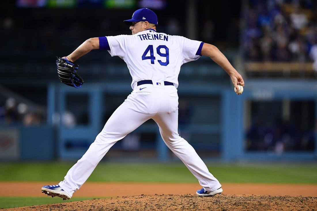 Apr 14, 2022; Los Angeles, California, USA; Los Angeles Dodgers relief pitcher Blake Treinen (49) throws against the Cincinnati Reds during the eighth inning at Dodger Stadium. Mandatory Credit: Gary A. Vasquez-USA TODAY Sports