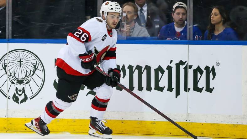 Apr 9, 2022; New York, New York, USA; Ottawa Senators defenseman Erik Brannstrom (26) controls the puck against New York Rangers during the second period at Madison Square Garden. Mandatory Credit: Tom Horak-USA TODAY Sports