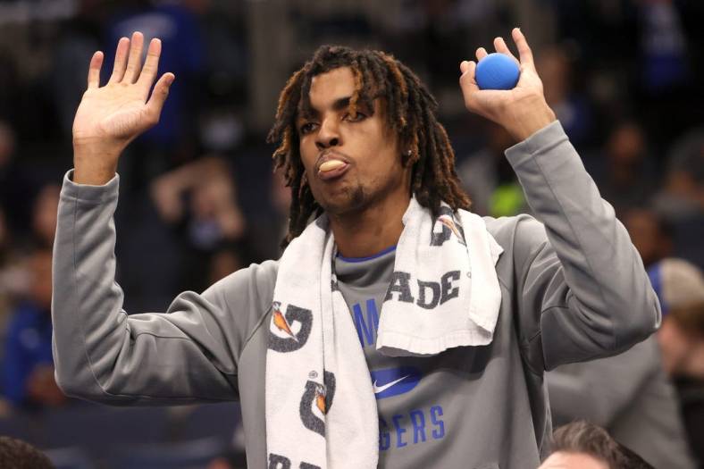 Memphis guard Emoni Bates cheers on his team from the sidelines as they take on Tulane at FedExForum in Memphis on Feb. 9, 2022.

Syndication The Commercial Appeal