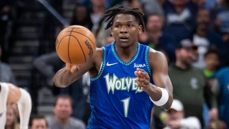 Apr 21, 2022; Minneapolis, Minnesota, USA; Minnesota Timberwolves forward Anthony Edwards (1) passes against the Memphis Grizzlies in the fourth quarter during game one of the three round for the 2022 NBA playoffs at Target Center. Mandatory Credit: Brad Rempel-USA TODAY Sports