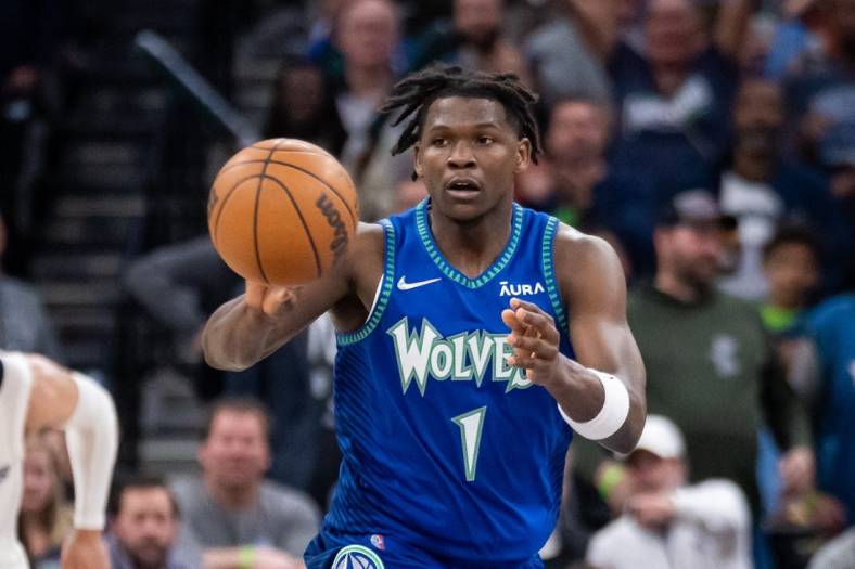 Apr 21, 2022; Minneapolis, Minnesota, USA; Minnesota Timberwolves forward Anthony Edwards (1) passes against the Memphis Grizzlies in the fourth quarter during game one of the three round for the 2022 NBA playoffs at Target Center. Mandatory Credit: Brad Rempel-USA TODAY Sports