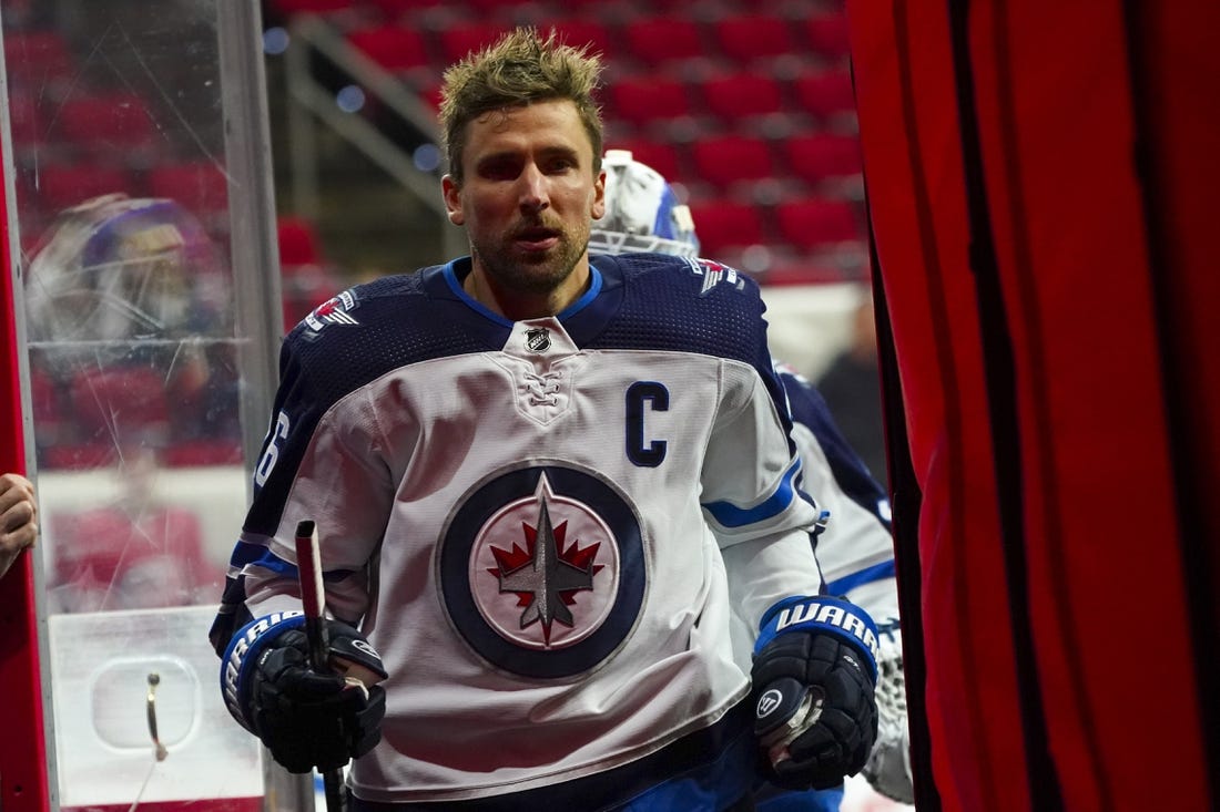 Apr 21, 2022; Raleigh, North Carolina, USA;  Winnipeg Jets right wing Blake Wheeler (26)  comes off the ice against the Carolina Hurricanes before the game at PNC Arena. Mandatory Credit: James Guillory-USA TODAY Sports