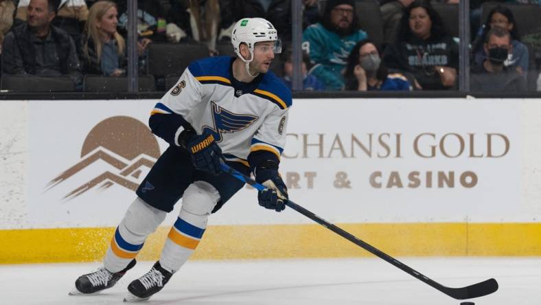 Apr 21, 2022; San Jose, California, USA;  St. Louis Blues defenseman Marco Scandella (6) controls the puck during the second period against the San Jose Sharks at SAP Center at San Jose. Mandatory Credit: Stan Szeto-USA TODAY Sports