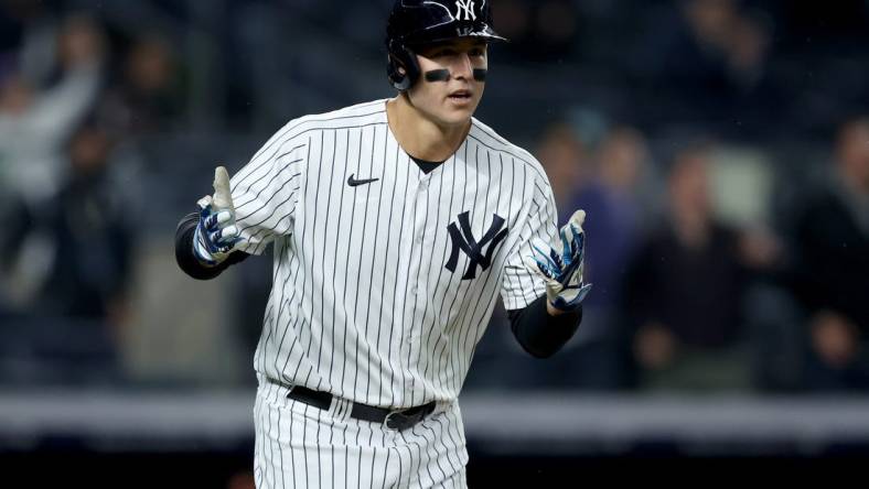 Apr 26, 2022; Bronx, New York, USA; New York Yankees first baseman Anthony Rizzo (48) reacts after hitting a solo home run against the Baltimore Orioles during the eighth inning at Yankee Stadium. The home run was his third of the game. Mandatory Credit: Brad Penner-USA TODAY Sports