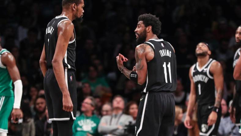 Apr 23, 2022; Brooklyn, New York, USA;  Brooklyn Nets forward Kevin Durant (7) and guard Kyrie Irving (11) at Barclays Center. Mandatory Credit: Wendell Cruz-USA TODAY Sports