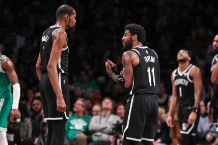 Apr 23, 2022; Brooklyn, New York, USA;  Brooklyn Nets forward Kevin Durant (7) and guard Kyrie Irving (11) at Barclays Center. Mandatory Credit: Wendell Cruz-USA TODAY Sports