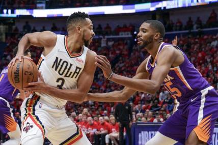 Apr 28, 2022; New Orleans, Louisiana, USA;  New Orleans Pelicans guard CJ McCollum (3) is defended by Phoenix Suns forward Mikal Bridges (25) during the first half of game six of the first round for the 2022 NBA playoffs at Smoothie King Center. Mandatory Credit: Stephen Lew-USA TODAY Sports