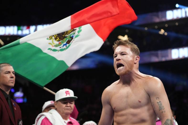May 7, 2022; Las Vegas, Nevada, USA; Canelo Alvarez enters the arena to face Dimitry Bivol (not pictured) in their light heavyweight championship bout at T-Mobile Arena. Mandatory Credit: Joe Camporeale-USA TODAY Sports