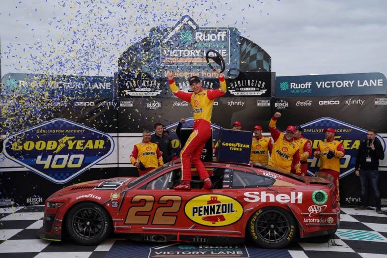 May 8, 2022; Darlington, South Carolina, USA; NASCAR Cup Series driver Joey Logano (22) celebrates after winning the Goodyear 400 at Darlington Raceway. Mandatory Credit: Jasen Vinlove-USA TODAY Sports