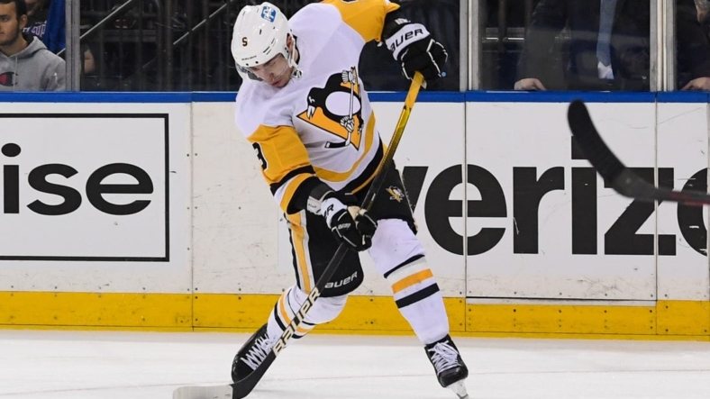 May 11, 2022; New York, New York, USA; Pittsburgh Penguins center Evan Rodrigues (9) takes a shot against the New York Rangers during the third period in game five of the first round of the 2022 Stanley Cup Playoffs at Madison Square Garden. Mandatory Credit: Dennis Schneidler-USA TODAY Sports