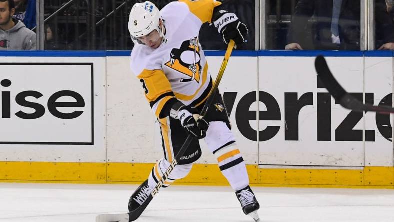 May 11, 2022; New York, New York, USA; Pittsburgh Penguins center Evan Rodrigues (9) takes a shot against the New York Rangers during the third period in game five of the first round of the 2022 Stanley Cup Playoffs at Madison Square Garden. Mandatory Credit: Dennis Schneidler-USA TODAY Sports