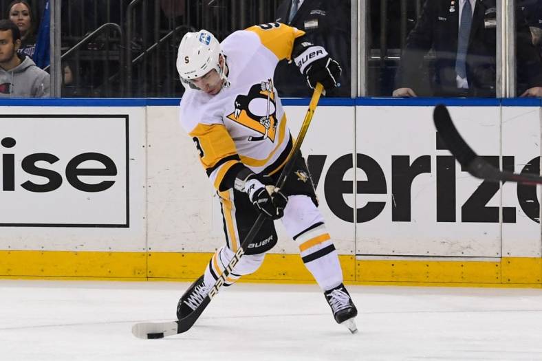 May 11, 2022; New York, New York, USA; Pittsburgh Penguins center Evan Rodrigues (9) takes a shot against the New York Rangers during the third period in game five of the first round of the 2022 Stanley Cup Playoffs at Madison Square Garden. Mandatory Credit: Dennis Schneidler-USA TODAY Sports