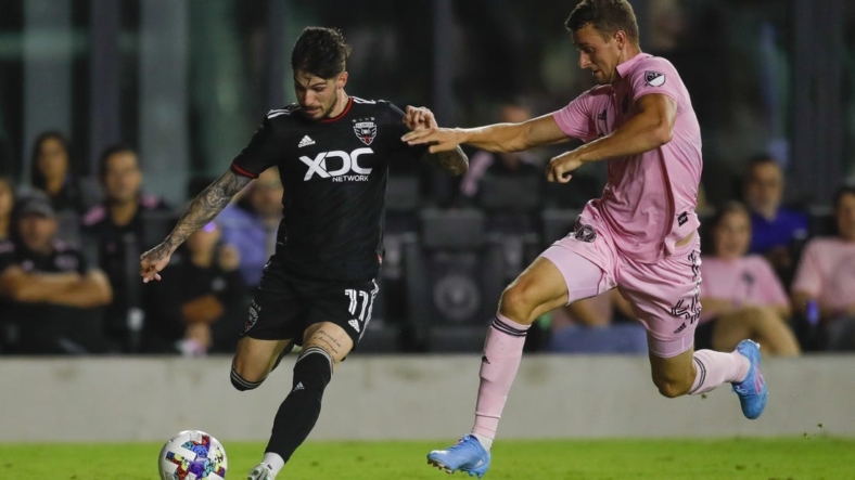May 14, 2022; Fort Lauderdale, Florida, USA; D.C. United forward Taxiarchis Fountas (11) controls the ball against Inter Miami CF defender Christopher McVey (4) during the second half at DRV PNK Stadium. Mandatory Credit: Sam Navarro-USA TODAY Sports