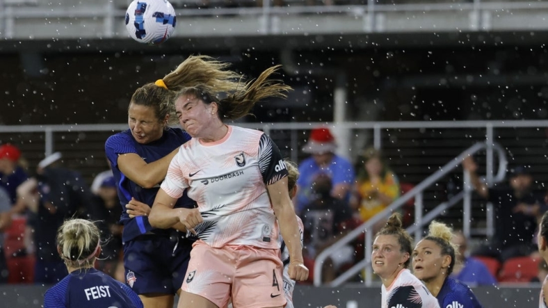 May 15, 2022; Washington, District of Columbia, USA; Washington Spirit defender Sam Staab (3) and Angel City FC defender Vanessa Gilles (4) leap to head the ball in the second half at Audi Field. Mandatory Credit: Geoff Burke-USA TODAY Sports