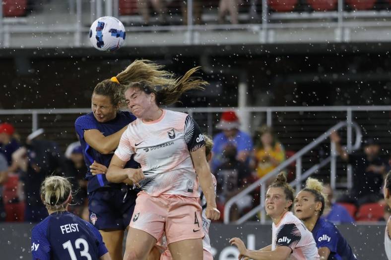 May 15, 2022; Washington, District of Columbia, USA; Washington Spirit defender Sam Staab (3) and Angel City FC defender Vanessa Gilles (4) leap to head the ball in the second half at Audi Field. Mandatory Credit: Geoff Burke-USA TODAY Sports