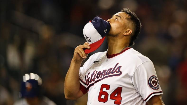 May 11, 2022; Washington, District of Columbia, USA; Washington Nationals relief pitcher Victor Arano (64) reacts after pitching against the New York Mets at Nationals Park. Mandatory Credit: Scott Taetsch-USA TODAY Sports