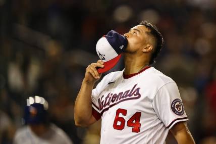 May 11, 2022; Washington, District of Columbia, USA; Washington Nationals relief pitcher Victor Arano (64) reacts after pitching against the New York Mets at Nationals Park. Mandatory Credit: Scott Taetsch-USA TODAY Sports
