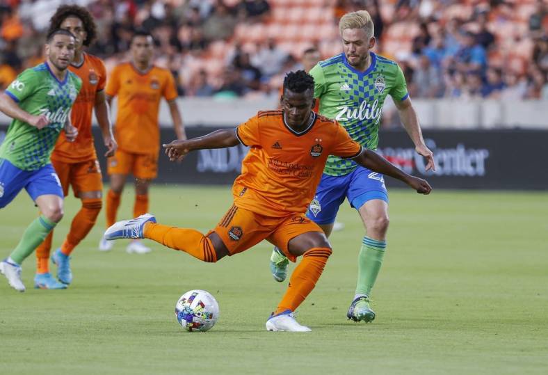 May 18, 2022; Houston, Texas, USA; Houston Dynamo FC forward Darwin Quintero (23) kicks the ball during the first half against the Seattle Sounders FC at PNC Stadium. Mandatory Credit: Troy Taormina-USA TODAY Sports