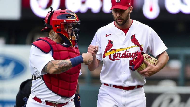 May 26, 2022; St. Louis, Missouri, USA;  St. Louis Cardinals starting pitcher Adam Wainwright (50) and catcher Yadier Molina (4) walk in from the bullpen before a game against the Milwaukee Brewers at Busch Stadium. Mandatory Credit: Jeff Curry-USA TODAY Sports