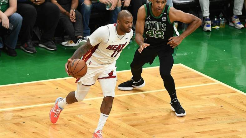 May 27, 2022; Boston, Massachusetts, USA; Miami Heat forward P.J. Tucker (17) moves the ball against Boston Celtics center Al Horford (42) during the second half in game six of the 2022 eastern conference finals at TD Garden. Mandatory Credit: Brian Fluharty-USA TODAY Sports