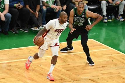 May 27, 2022; Boston, Massachusetts, USA; Miami Heat forward P.J. Tucker (17) moves the ball against Boston Celtics center Al Horford (42) during the second half in game six of the 2022 eastern conference finals at TD Garden. Mandatory Credit: Brian Fluharty-USA TODAY Sports