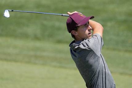 Jun 1, 2022; Scottsdale, Arizona, USA; David Puig of Arizona State plays his second shot on the first hole against opponent Mason Nome of Texas during the final round of match play in the NCAA DI Mens Golf Championships at Grayhawk Golf Club - Raptor Course. Mandatory Credit: Rob Schumacher-Arizona Republic

Golf Ncaa Di Mens Golf Championships