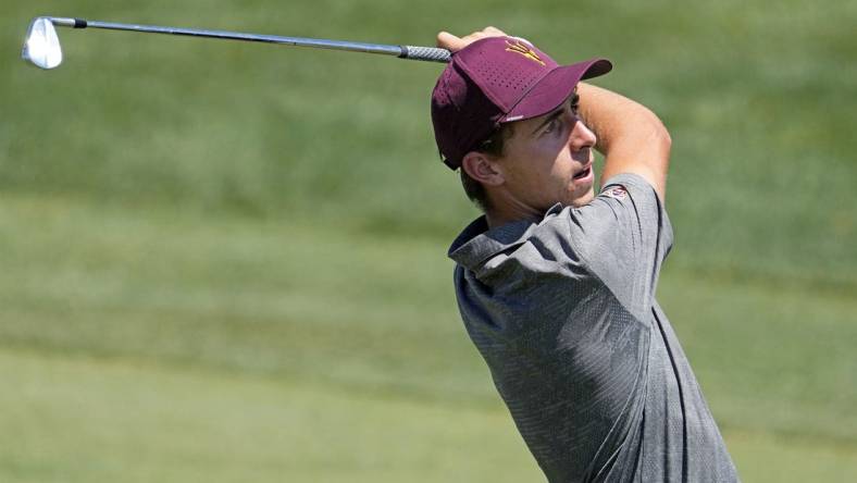 Jun 1, 2022; Scottsdale, Arizona, USA; David Puig of Arizona State plays his second shot on the first hole against opponent Mason Nome of Texas during the final round of match play in the NCAA DI Mens Golf Championships at Grayhawk Golf Club - Raptor Course. Mandatory Credit: Rob Schumacher-Arizona Republic

Golf Ncaa Di Mens Golf Championships