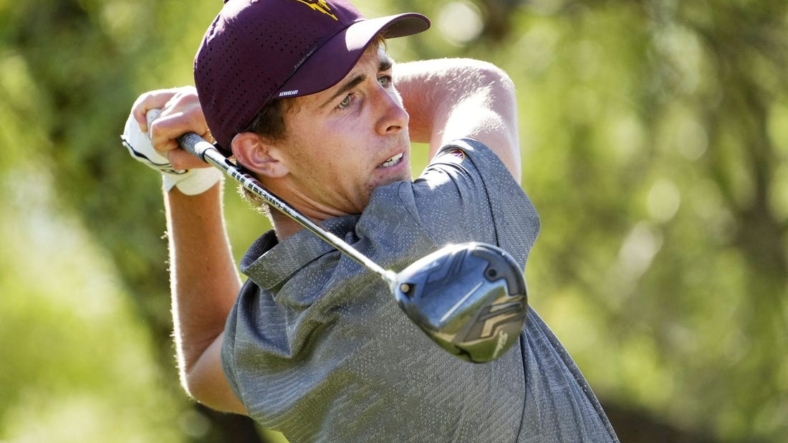 Jun 1, 2022; Scottsdale, Arizona, USA; David Puig of Arizona State plays his the shot on the 12th hole against Mason Nome of Texas during the final round of match play in the NCAA DI Mens Golf Championships at Grayhawk Golf Club - Raptor Course. Mandatory Credit: Rob Schumacher-Arizona RepublicGolf Ncaa Di Mens Golf Championships