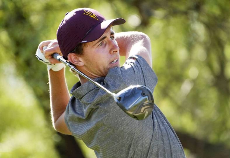 Jun 1, 2022; Scottsdale, Arizona, USA; David Puig of Arizona State plays his the shot on the 12th hole against Mason Nome of Texas during the final round of match play in the NCAA DI Mens Golf Championships at Grayhawk Golf Club - Raptor Course. Mandatory Credit: Rob Schumacher-Arizona Republic

Golf Ncaa Di Mens Golf Championships