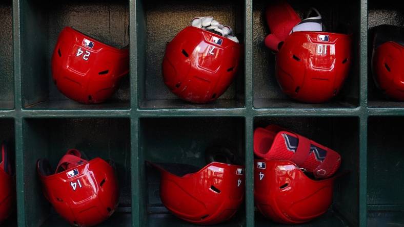 Jun 6, 2022; Anaheim, California, USA; Batting helmets of Los Angeles Angels players in the dugout during a game against the Boston Red Sox at Angel Stadium. Mandatory Credit: Kirby Lee-USA TODAY Sports