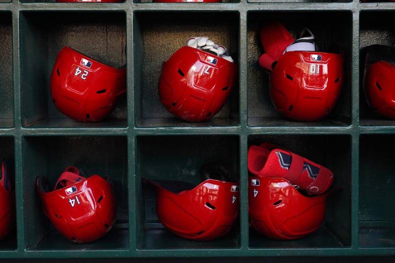 Jun 6, 2022; Anaheim, California, USA; Batting helmets of Los Angeles Angels players in the dugout during a game against the Boston Red Sox at Angel Stadium. Mandatory Credit: Kirby Lee-USA TODAY Sports