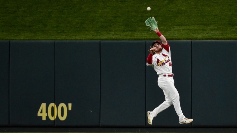 Jun 10, 2022; St. Louis, Missouri, USA;  St. Louis Cardinals center fielder Harrison Bader (48) leaps to catch a line drive against the Cincinnati Reds during the fourth inning at Busch Stadium. Mandatory Credit: Jeff Curry-USA TODAY Sports