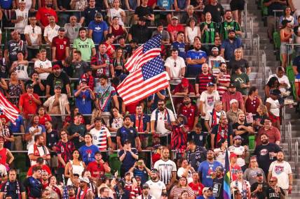 Fans wave American flags during United States men's national team soccer match against Grenada at Q2 Stadium in Austin, Texas on June 10, 2022.

Aem Usmnt Vs Grenada 061022 19