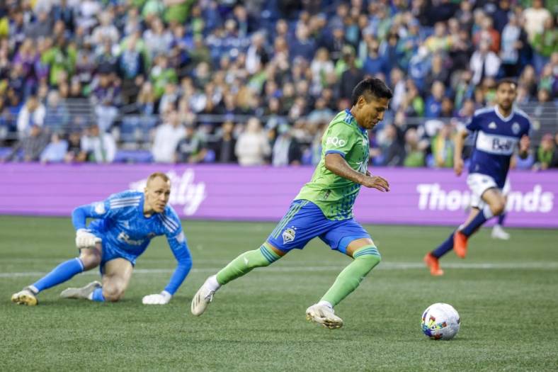 Jun 14, 2022; Seattle, Washington, USA; Seattle Sounders FC forward Raul Ruidiaz (9) attempts a shot on the goal against the Vancouver Whitecaps during the second half at Lumen Field. Mandatory Credit: Joe Nicholson-USA TODAY Sports