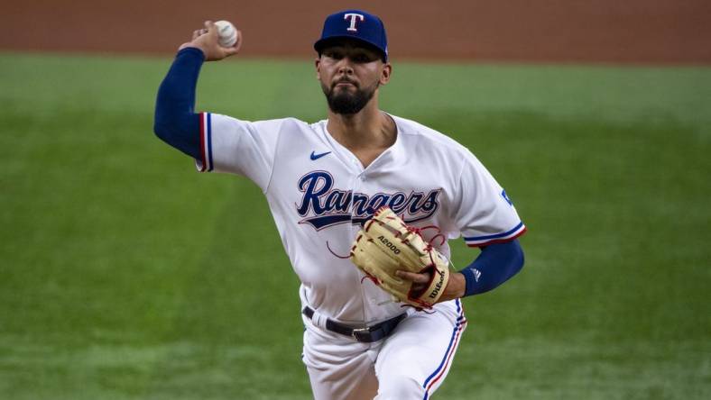 Jun 15, 2022; Arlington, Texas, USA; Texas Rangers starting pitcher Tyson Miller (76) pitches against the Houston Astros during the first inning at Globe Life Field. Mandatory Credit: Jerome Miron-USA TODAY Sports