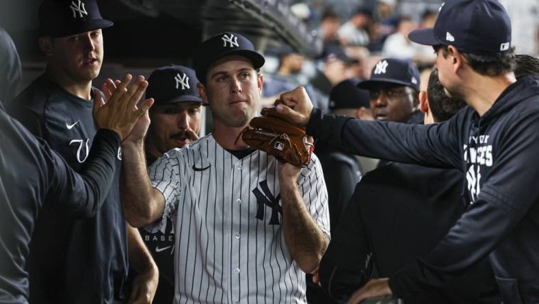 Jun 16, 2022; Bronx, New York, USA; New York Yankees relief pitcher Ryan Weber (85) is congratulated by teammates after being relieved from the game during the seventh inning against the Tampa Bay Rays at Yankee Stadium. Mandatory Credit: Vincent Carchietta-USA TODAY Sports