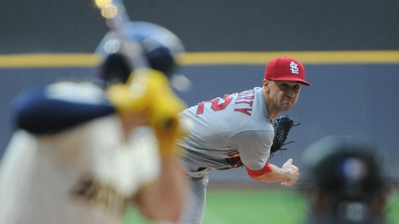 Jun 21, 2022; Milwaukee, Wisconsin, USA;  St. Louis Cardinals starting pitcher Jack Flaherty (22) gives up a home run to Milwaukee Brewers shortstop Willy Adames (27) in the first inning at American Family Field. Mandatory Credit: Michael McLoone-USA TODAY Sports