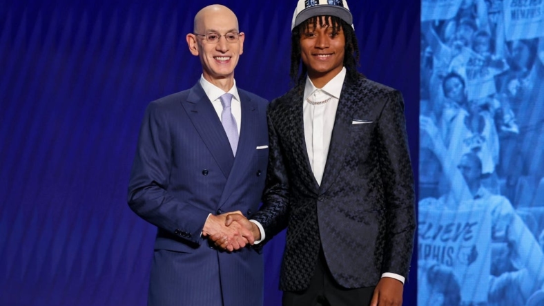 Jun 23, 2022; Brooklyn, NY, USA; TyTy Washington Jr. (Kentucky) shakes hands with NBA commissioner Adam Silver after being selected as the number twenty-nine overall pick by the Memphis Grizzlies in the first round of the 2022 NBA Draft at Barclays Center. Mandatory Credit: Brad Penner-USA TODAY Sports