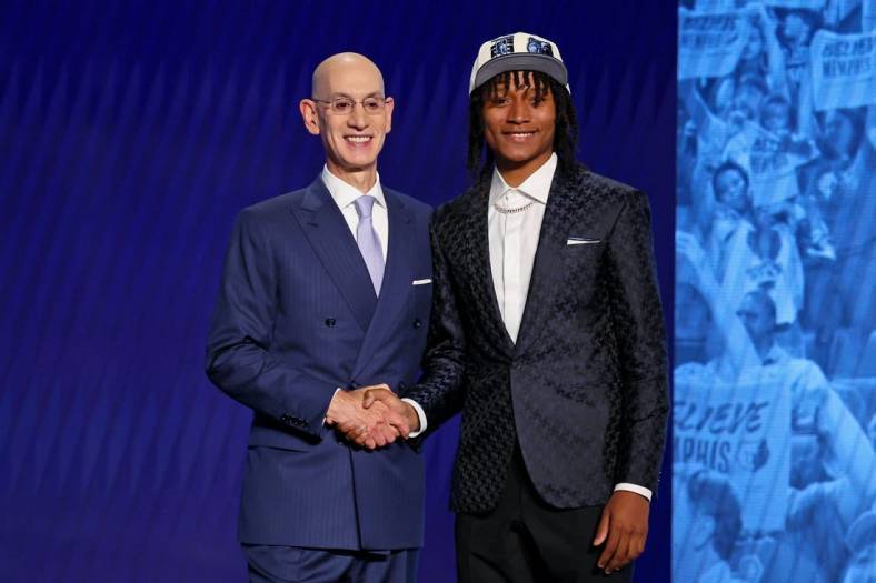 Jun 23, 2022; Brooklyn, NY, USA; TyTy Washington Jr. (Kentucky) shakes hands with NBA commissioner Adam Silver after being selected as the number twenty-nine overall pick by the Memphis Grizzlies in the first round of the 2022 NBA Draft at Barclays Center. Mandatory Credit: Brad Penner-USA TODAY Sports
