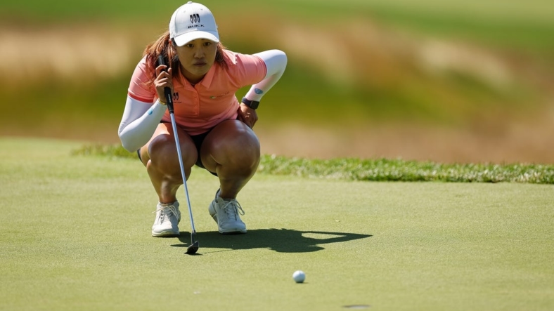 Jun 25, 2022; Bethesda, Maryland, USA; Xiyu Lin lines up a putt on the second green during the third round of the KPMG Women's PGA Championship golf tournament at Congressional Country Club. Mandatory Credit: Scott Taetsch-USA TODAY Sports