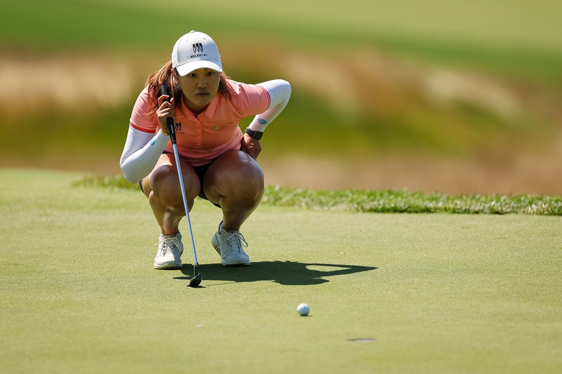 Jun 25, 2022; Bethesda, Maryland, USA; Xiyu Lin lines up a putt on the second green during the third round of the KPMG Women's PGA Championship golf tournament at Congressional Country Club. Mandatory Credit: Scott Taetsch-USA TODAY Sports