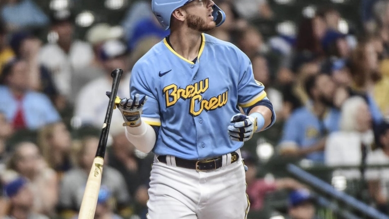 Jun 25, 2022; Milwaukee, Wisconsin, USA;  Milwaukee Brewers third baseman Mike Brosseau (20) watches after hitting a solo home run in the third inning during game against the Toronto Blue Jays at American Family Field. Mandatory Credit: Benny Sieu-USA TODAY Sports