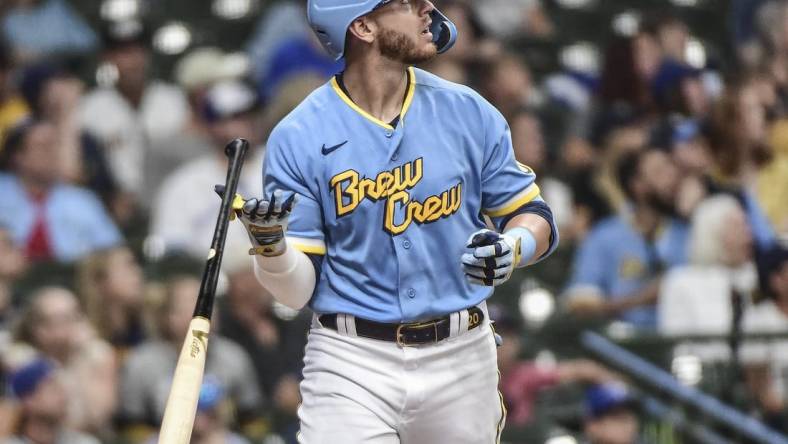 Jun 25, 2022; Milwaukee, Wisconsin, USA;  Milwaukee Brewers third baseman Mike Brosseau (20) watches after hitting a solo home run in the third inning during game against the Toronto Blue Jays at American Family Field. Mandatory Credit: Benny Sieu-USA TODAY Sports