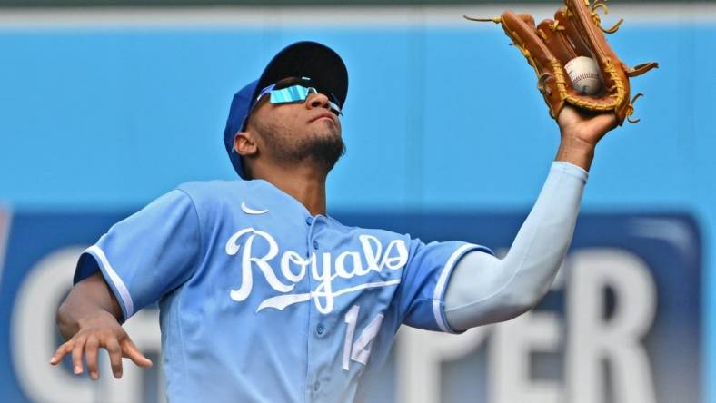 Jun 25, 2022; Kansas City, Missouri, USA; Kansas City Royals right fielder Edward Olivares (14) catches a fly ball in foul territory during the third inning against the Oakland Athletics at Kauffman Stadium. Mandatory Credit: Peter Aiken-USA TODAY Sports