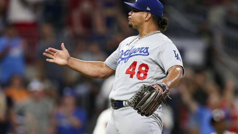 Jun 26, 2022; Atlanta, Georgia, USA; Los Angeles Dodgers relief pitcher Brusdar Graterol (48) celebrates after a victory against the Atlanta Braves at Truist Park. Mandatory Credit: Brett Davis-USA TODAY Sports