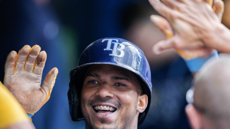 Jul 2, 2022; Toronto, Ontario, CAN; Tampa Bay Rays shortstop Wander Franco (5) celebrates in the dugout after hitting a home run against the Toronto Blue Jays during the sixth inning at Rogers Centre. Mandatory Credit: Nick Turchiaro-USA TODAY Sports